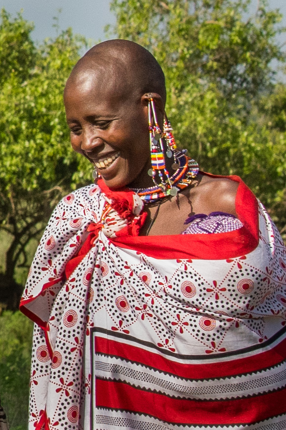 This Maasai woman shields her infant under her clothes so as to protect it from the intense sun.